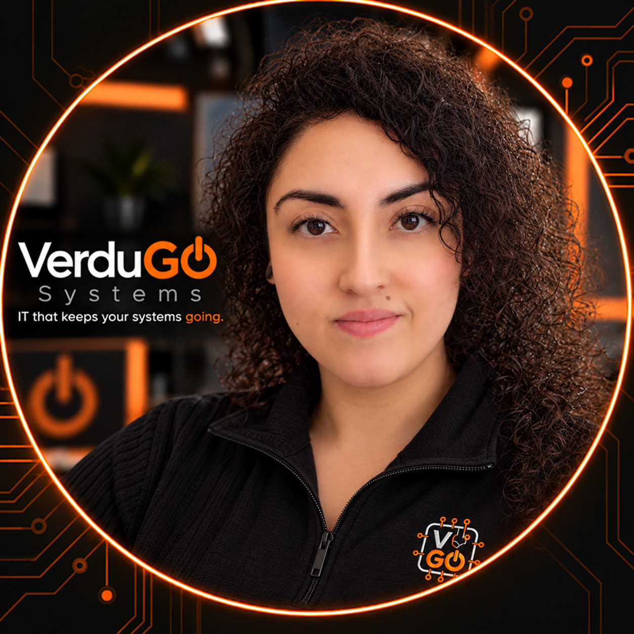 MiMi Verdugo in a black VerduGO pullover, framed by orange circuitry